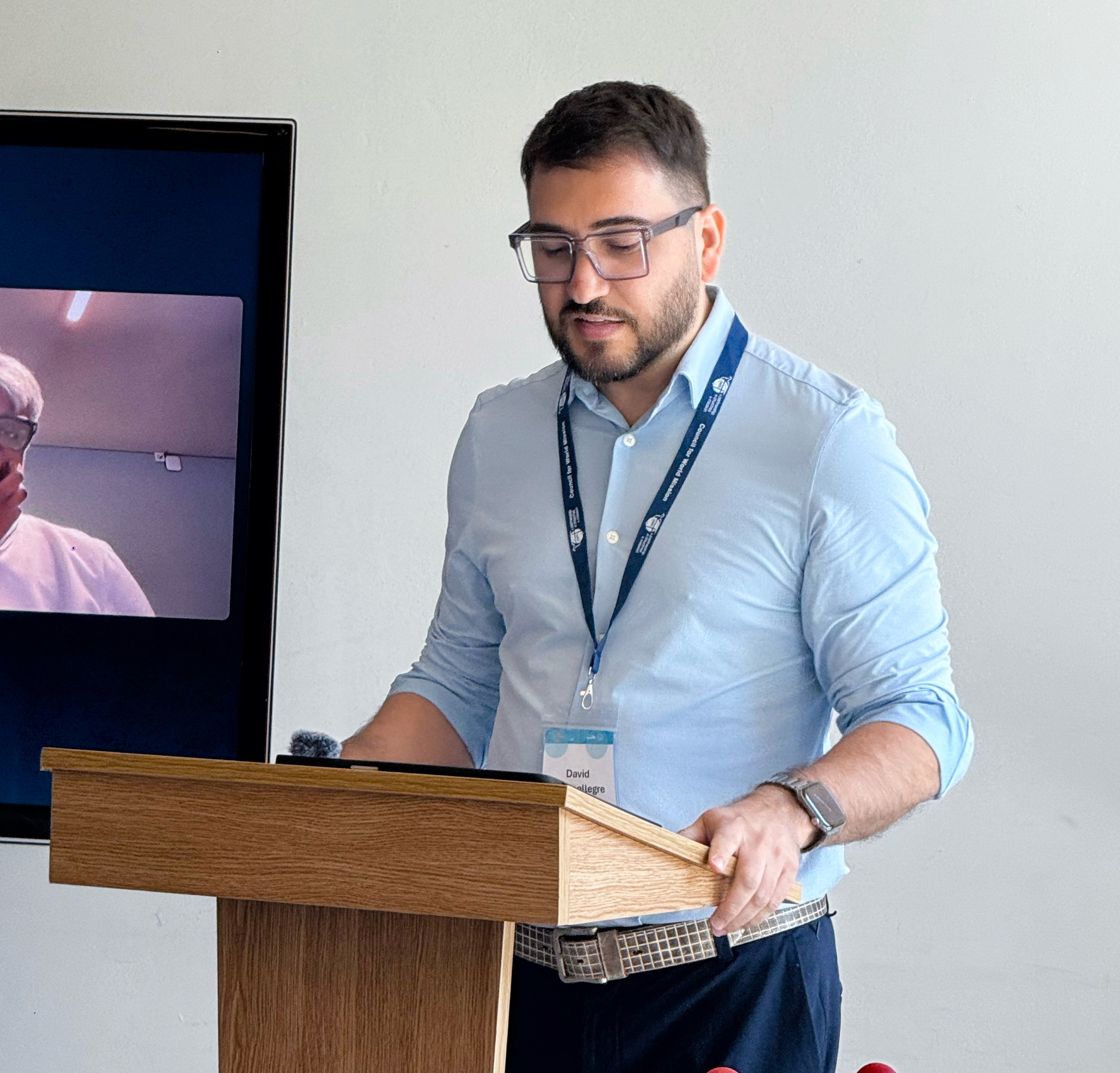 David presenting at a podium