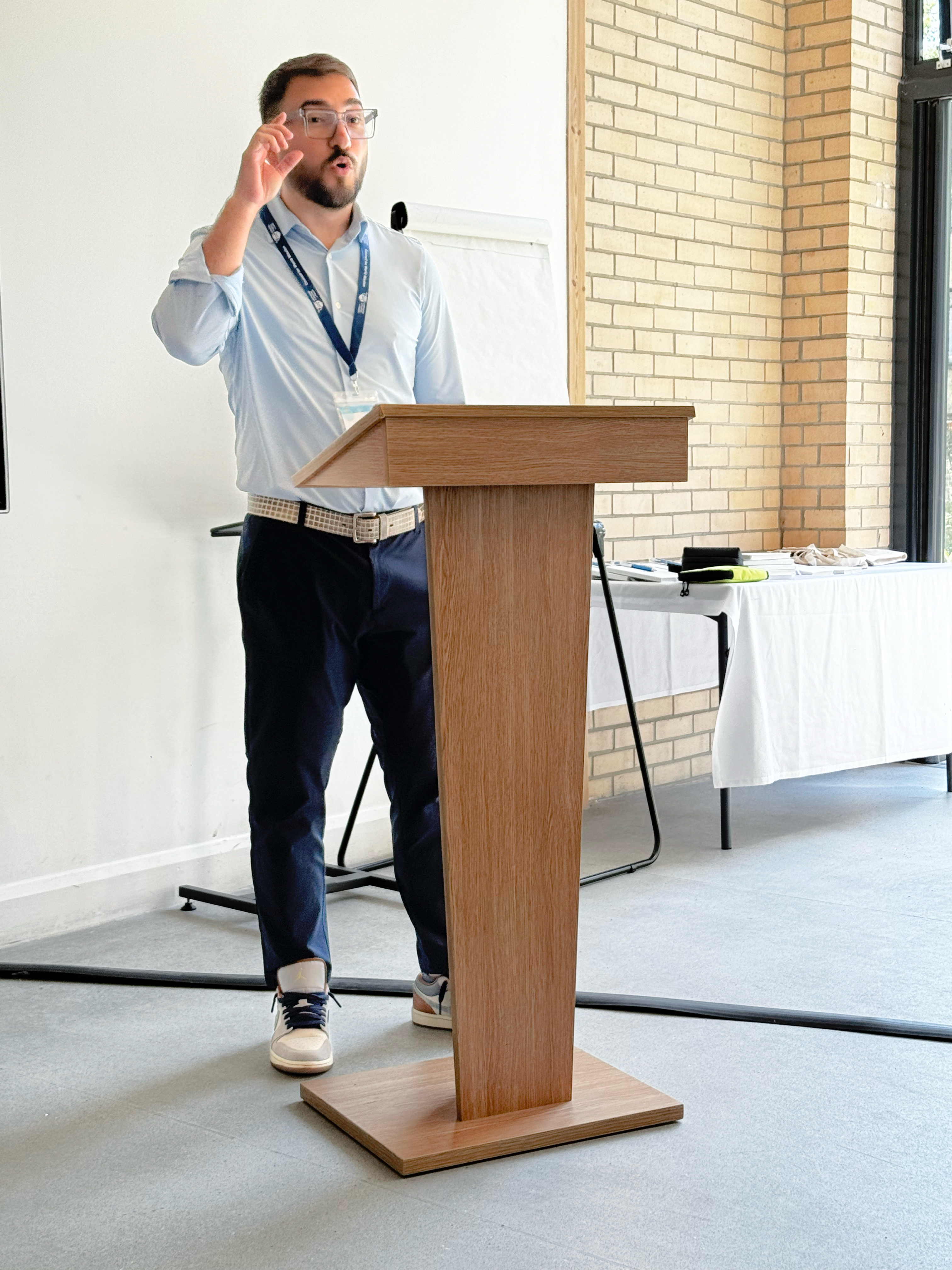 David speaking at a lectern
